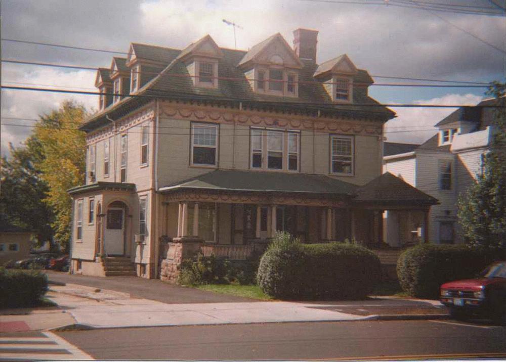 Second Empire style home with multi-color trim and cornice detail
